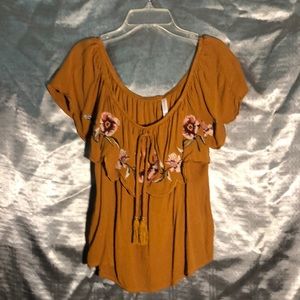 Off the shoulder, floral printed blouse.